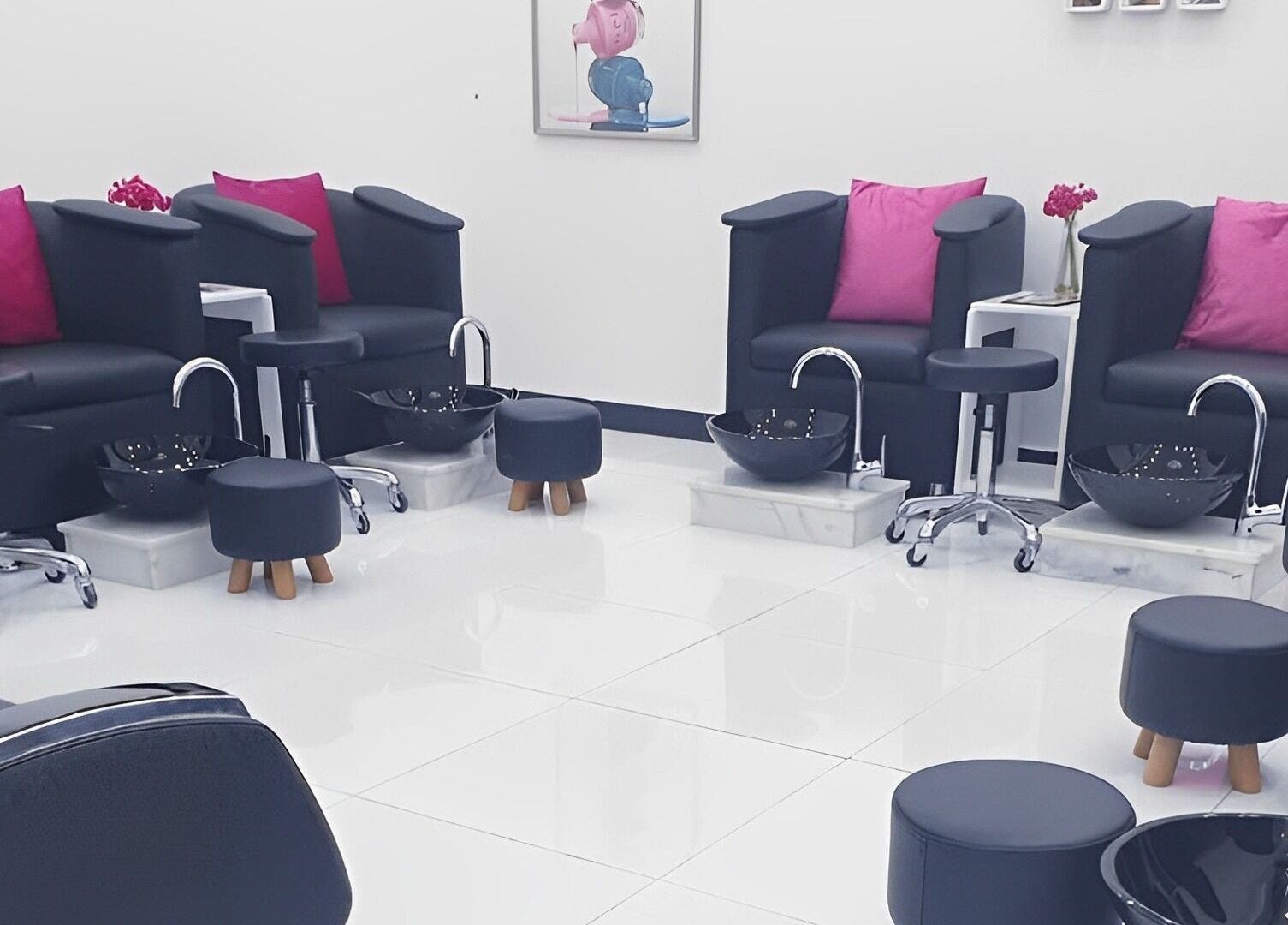 Luxurious pedicure stations at Ombre Salon FZE, Dubai, AE with plush seating in a modern, elegant setting.