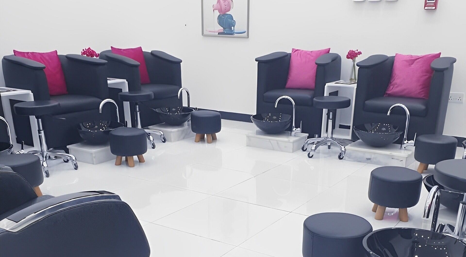 Luxurious pedicure stations at Ombre Salon FZE, Dubai, AE with plush seating in a modern, elegant setting.