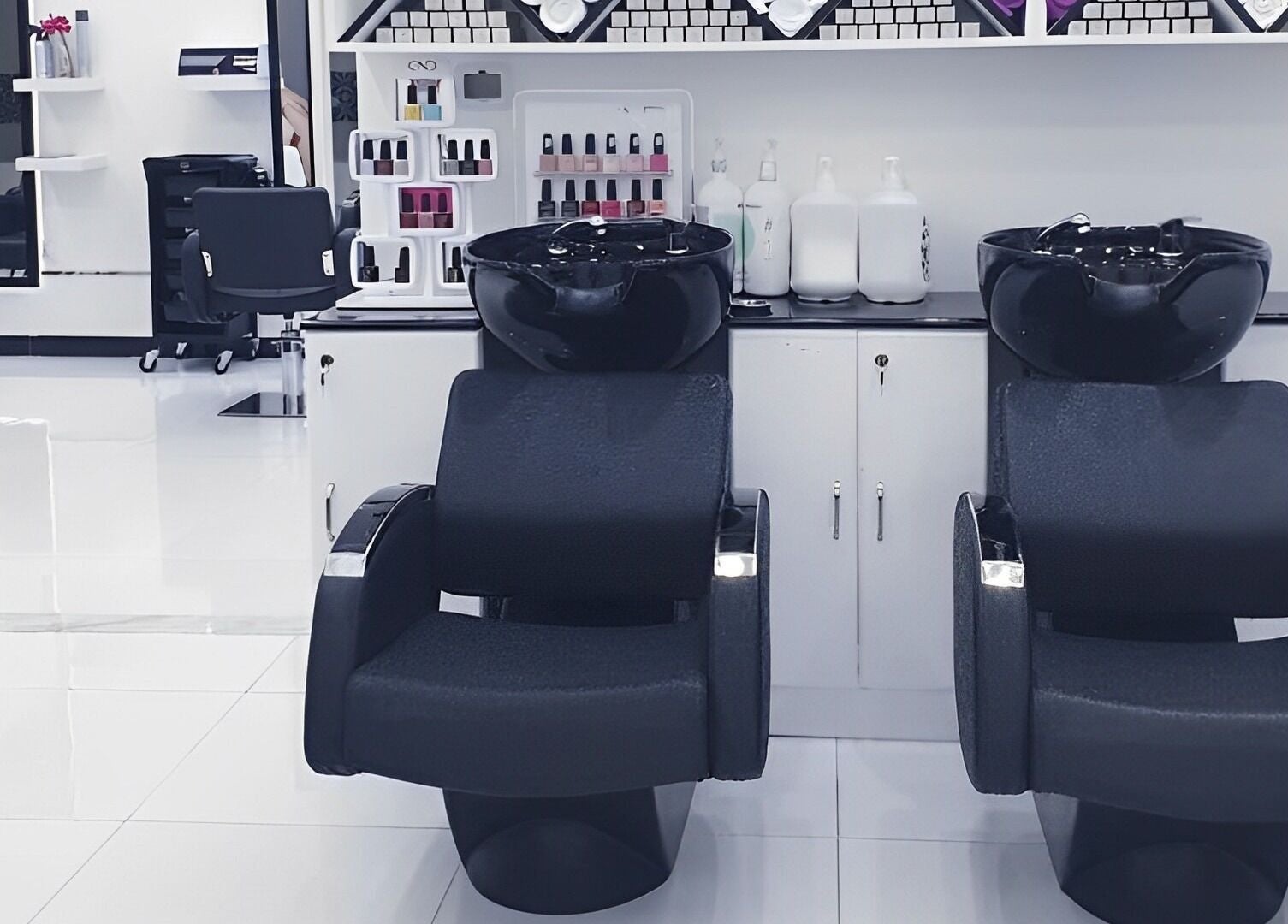 Modern salon interior at Ombre Salon FZE, Dubai, AE with sleek chairs and styling stations.