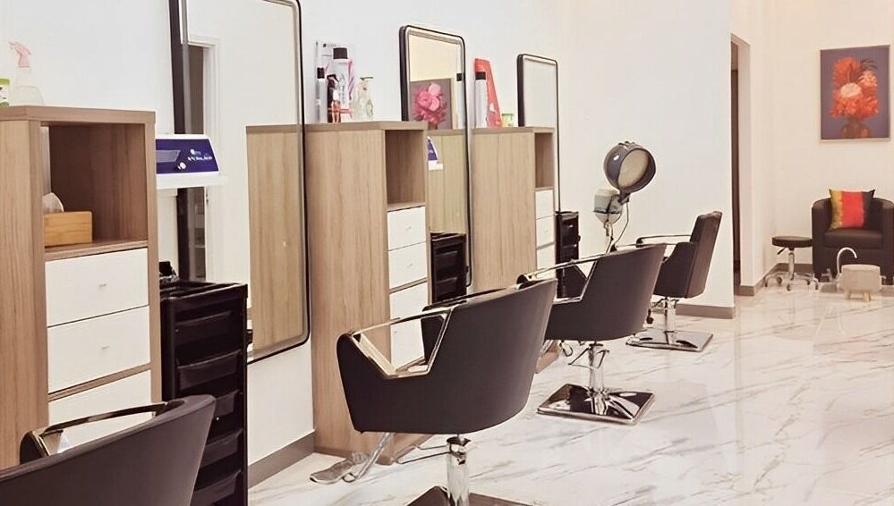 Modern hair salon at Ombre Salon for Ladies Branch, Dubai, Dubai, AE featuring chic styling chairs and mirrors.