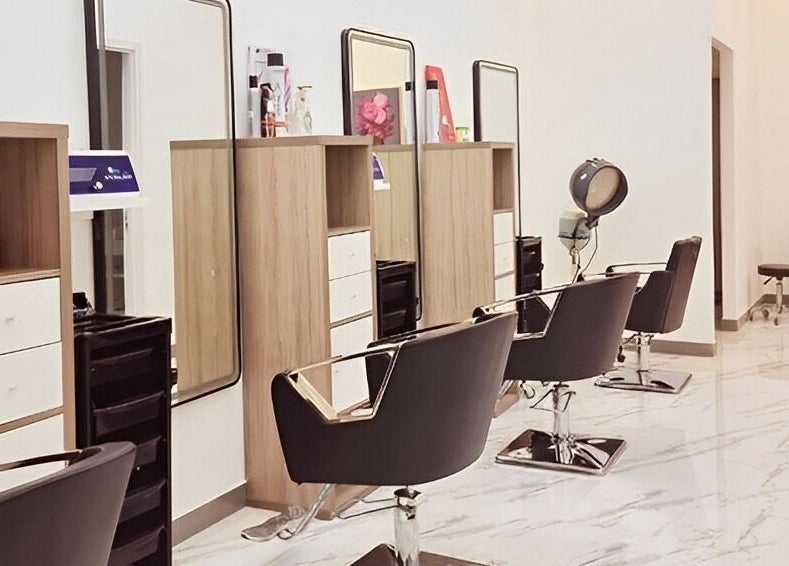 Modern hair salon at Ombre Salon for Ladies Branch, Dubai, Dubai, AE featuring chic styling chairs and mirrors.