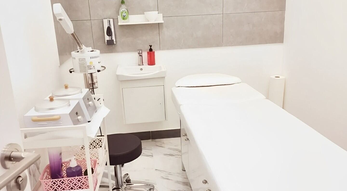 Tranquil spa room at Ombre Salon for Ladies Branch, Dubai, Dubai, AE, featuring a treatment bed and equipment.