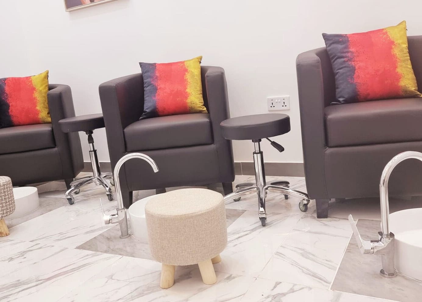 Plush seating area at Ombre Salon for Ladies Branch, Dubai, Dubai, AE, offering luxury beauty services.