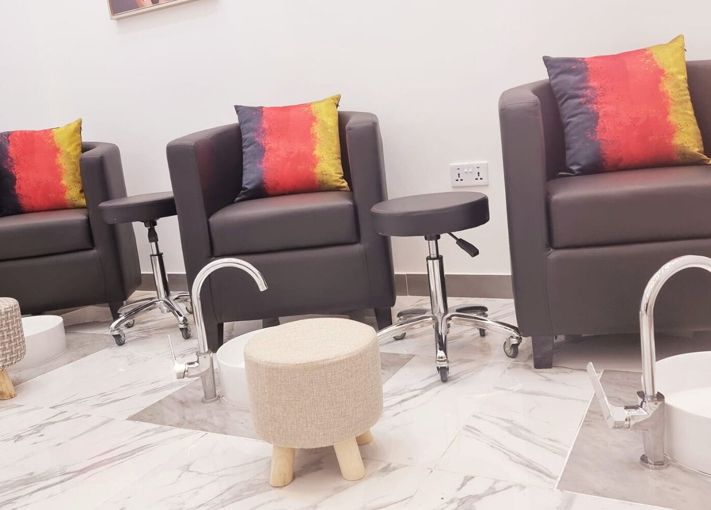 Plush seating area at Ombre Salon for Ladies Branch, Dubai, Dubai, AE, offering luxury beauty services.