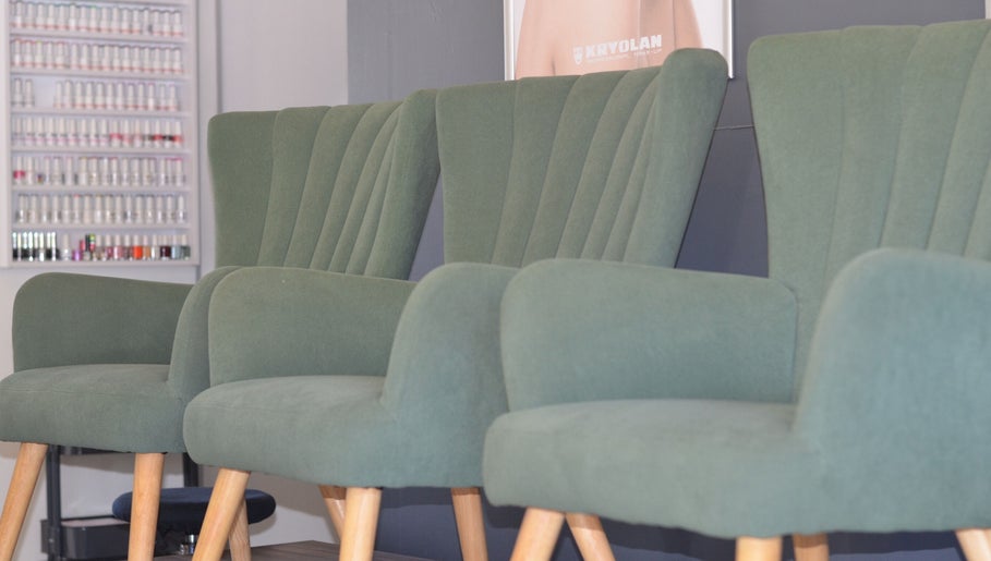 Stylish green chairs at Uptown Beauty, Hillcrest, Kwazulu-natal, ZA, offering a modern, relaxing ambiance.