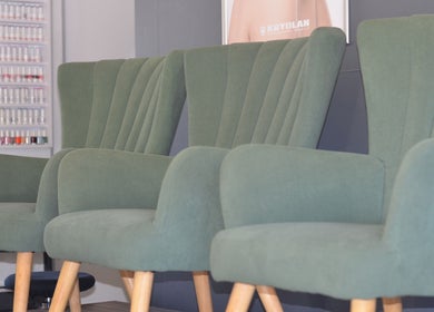 Stylish green chairs at Uptown Beauty, Hillcrest, Kwazulu-natal, ZA, offering a modern, relaxing ambiance.
