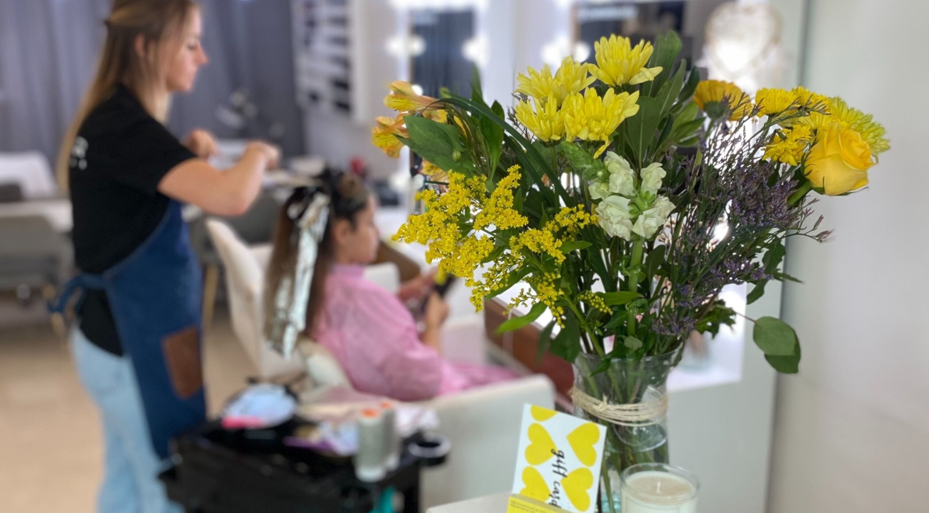 Floral arrangement beside hairstylist at Sukar, Playa del Carmen, Quintana Roo, MX.