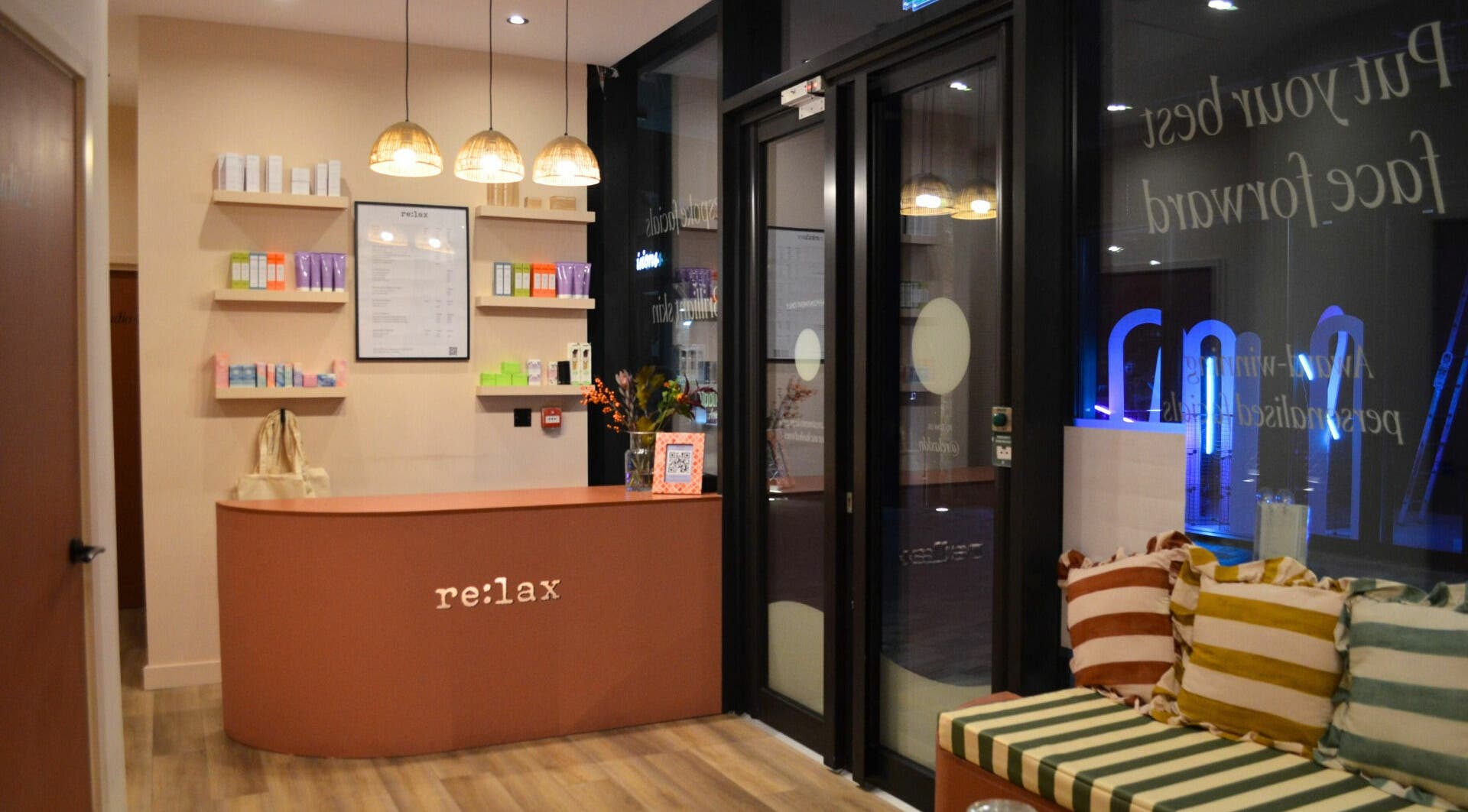 Welcoming reception area at re:lax Borough Yards, London, England, GB, with cozy seating and products on display.
