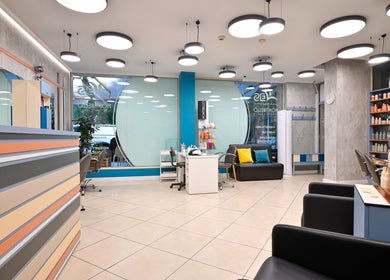 Chic interior of Varna Beauty Studio with modern decor in Варна, Варна, BG, featuring seating and product displays.