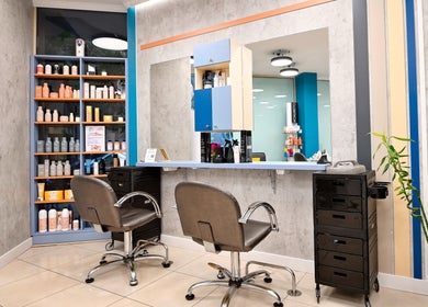 Modern salon interior at Varna Beauty Studio, Варна, Варна, BG featuring styling chairs and product displays.