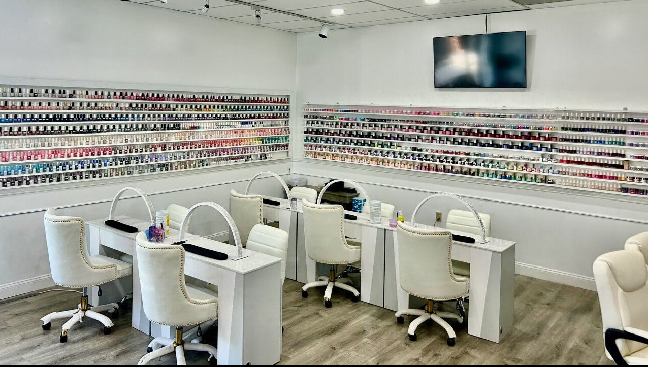Inside Petite Nails and Spa, showcasing chic, modern nail stations in Chelmsford, Massachusetts, US.