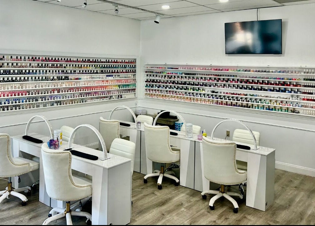 Inside Petite Nails and Spa, showcasing chic, modern nail stations in Chelmsford, Massachusetts, US.