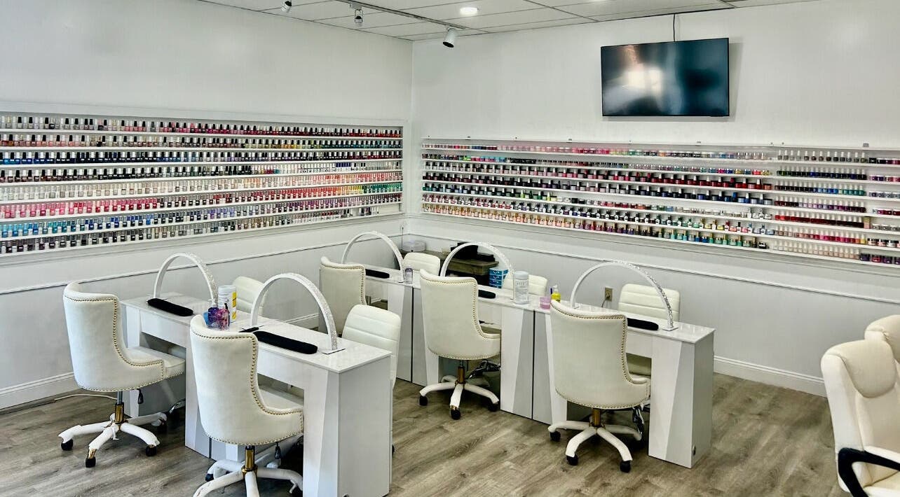 Inside Petite Nails and Spa, showcasing chic, modern nail stations in Chelmsford, Massachusetts, US.