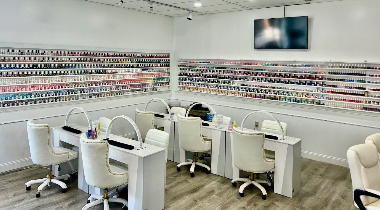 Inside Petite Nails and Spa, showcasing chic, modern nail stations in Chelmsford, Massachusetts, US.