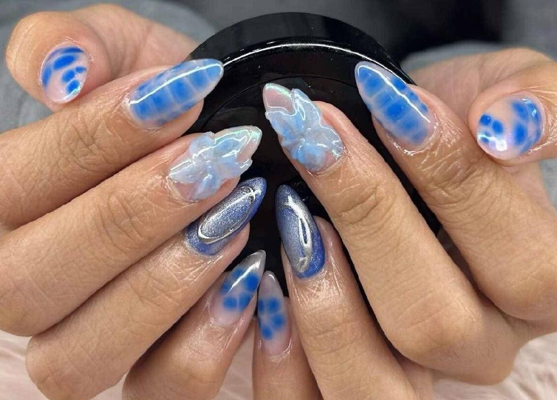 Elegant blue floral nail art at Petite Nails and Spa, Chelmsford, Massachusetts, US.
