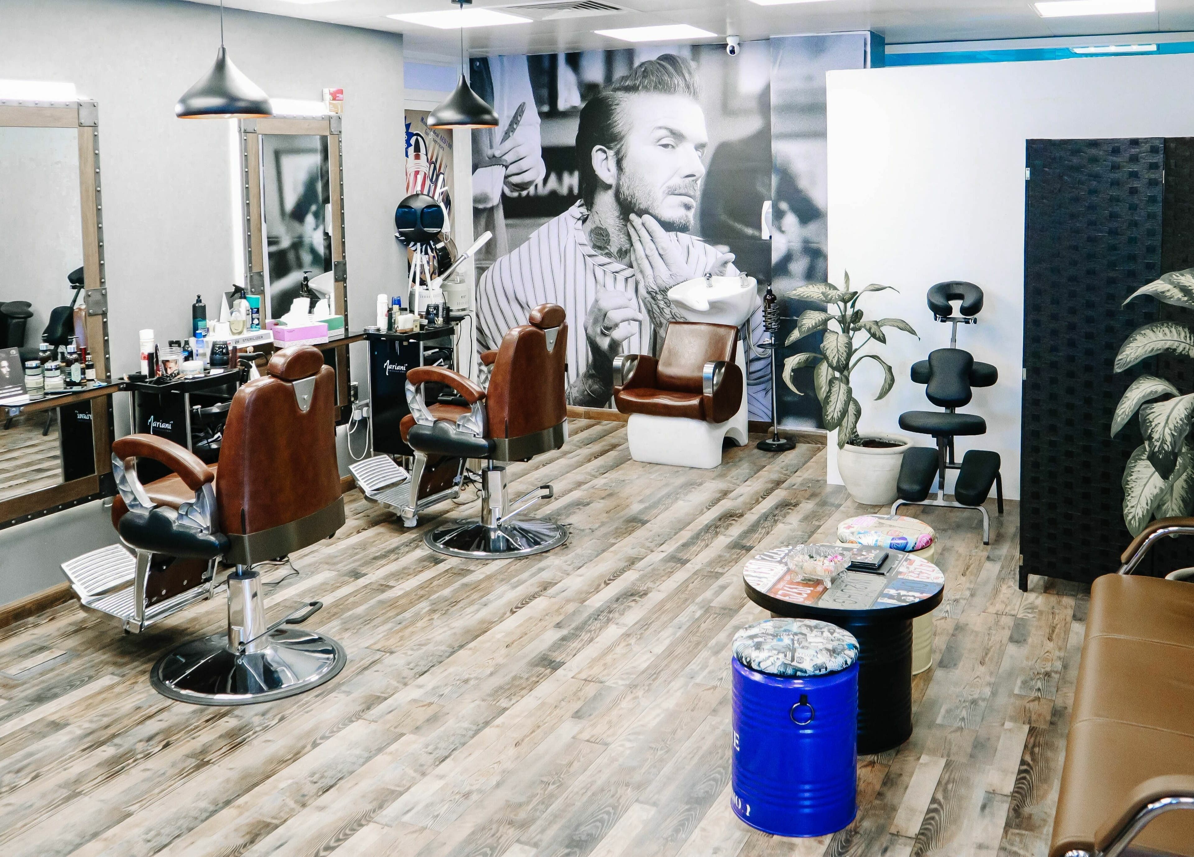 Interior of Sfizio Gent's Salon, Al Khail Branch, showcasing stylish barber chairs in Dubai, AE.