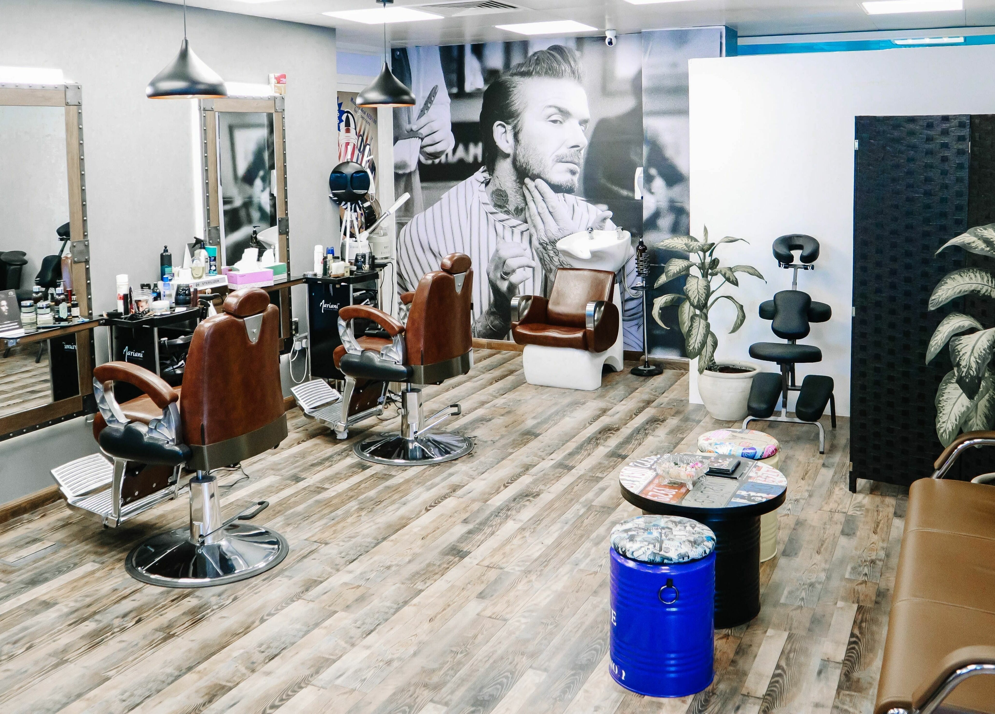 Interior of Sfizio Gent's Salon, Al Khail Branch, showcasing stylish barber chairs in Dubai, AE.