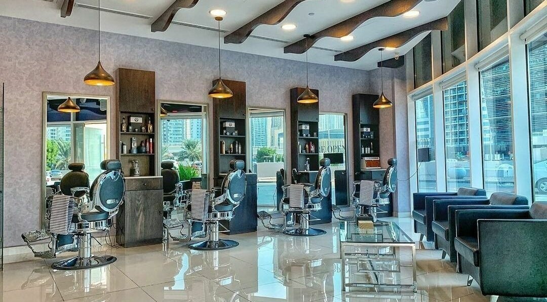 Sfizio Gent's Salon, Al Khail Branch's sleek interior in Dubai, AE, featuring stylish barber chairs and decor.