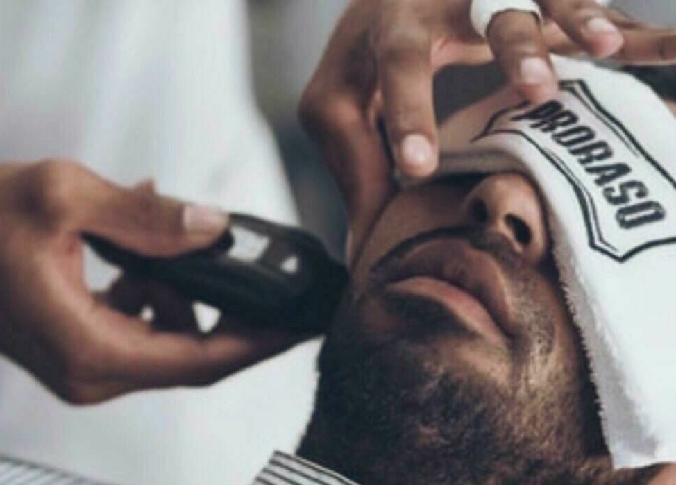 Relaxing grooming service at Sfizio Gent's Salon, Al Khail Branch, Dubai, AE. Experience top-notch facial care.