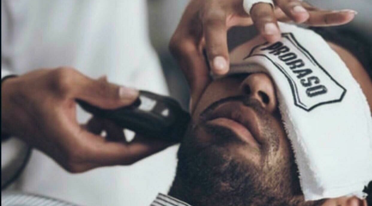 Relaxing grooming service at Sfizio Gent's Salon, Al Khail Branch, Dubai, AE. Experience top-notch facial care.