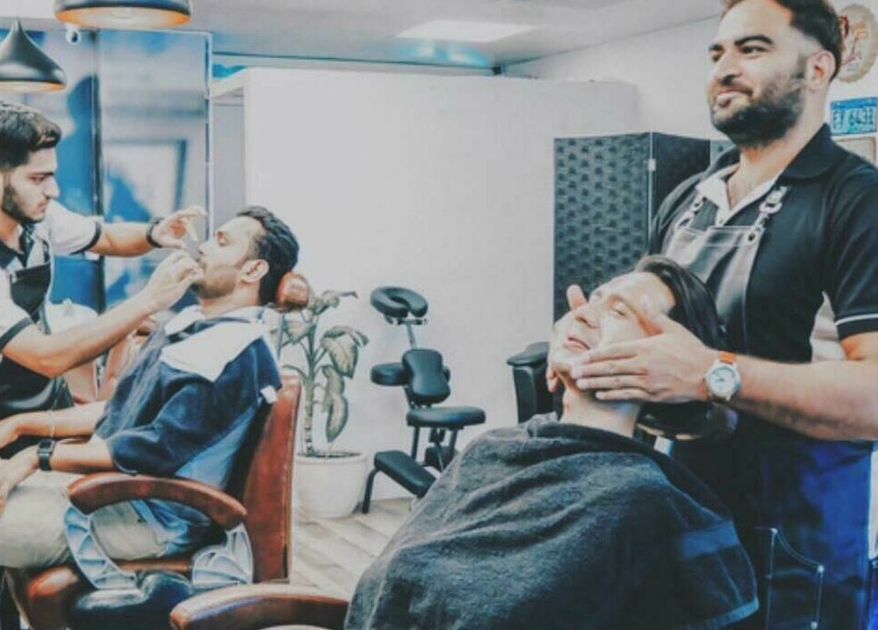 Barbers at Sfizio Gent's Salon, Al Khail Branch, Dubai, AE provide expert grooming services in a stylish setting.