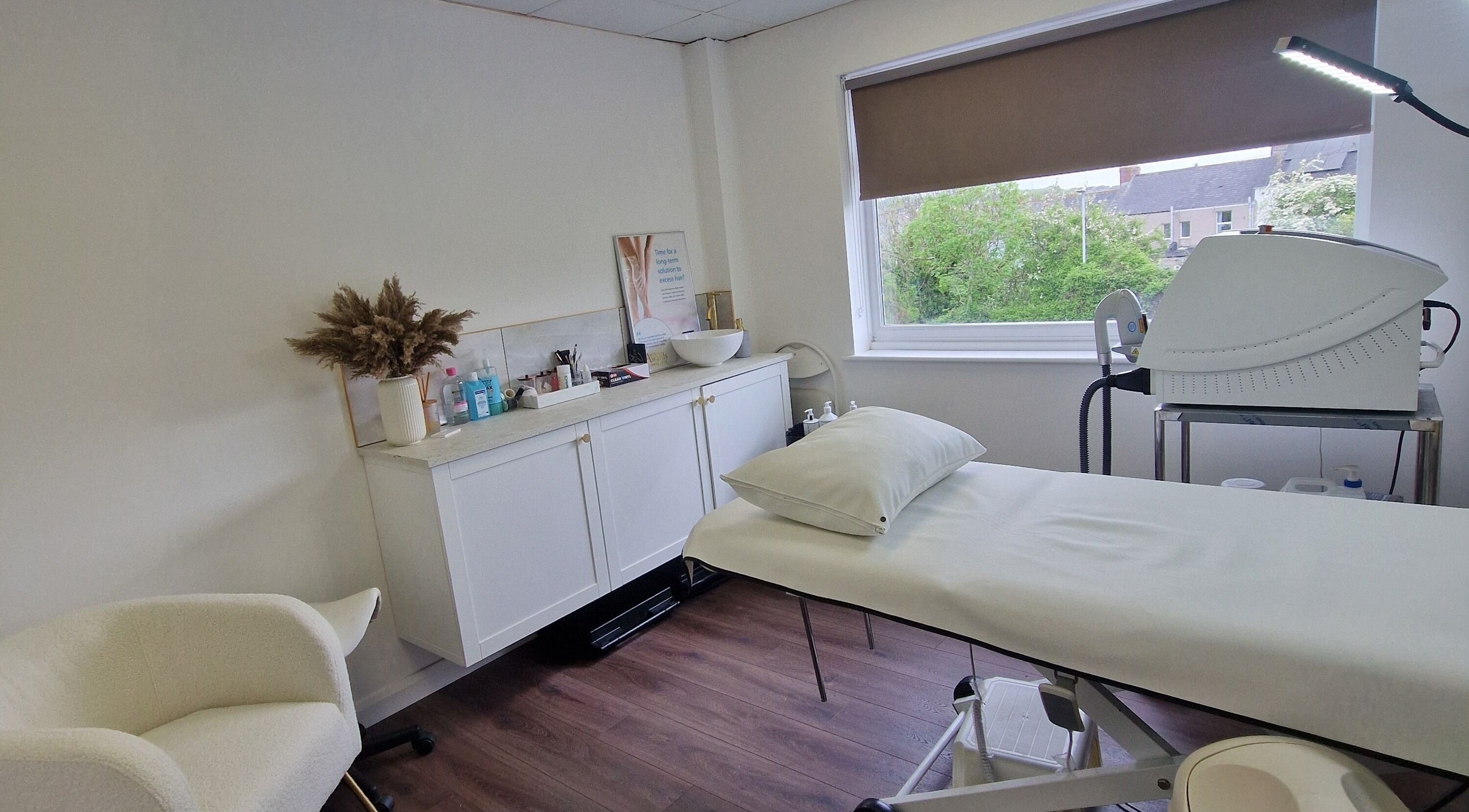Serene treatment room at Bare By Hayley Louise in Plymouth, England, GB, featuring a spa bed and calming decor.