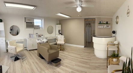Elegant interior of Elevate Salon Llc in Alpena, Michigan, US featuring modern chairs and shelves with beauty products.