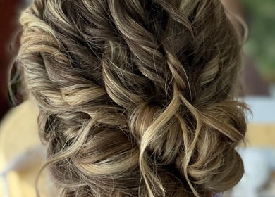 Intricate updo hairstyle at Elevate Salon Llc in Alpena, Michigan, US, showcasing expert styling.