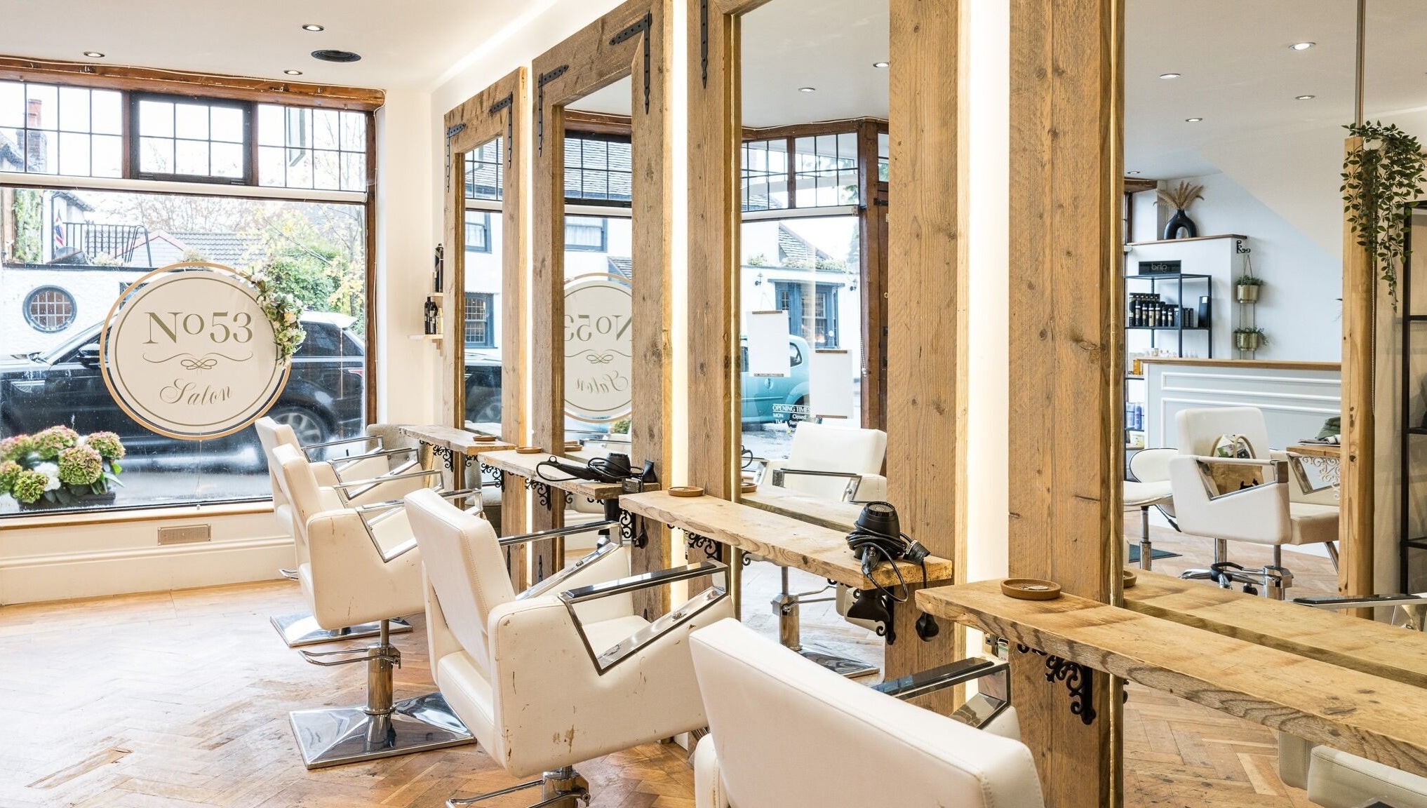 Elegant interior of No 53 Salon in Walton on the Hill, England. Featuring chic styling chairs and rustic decor.