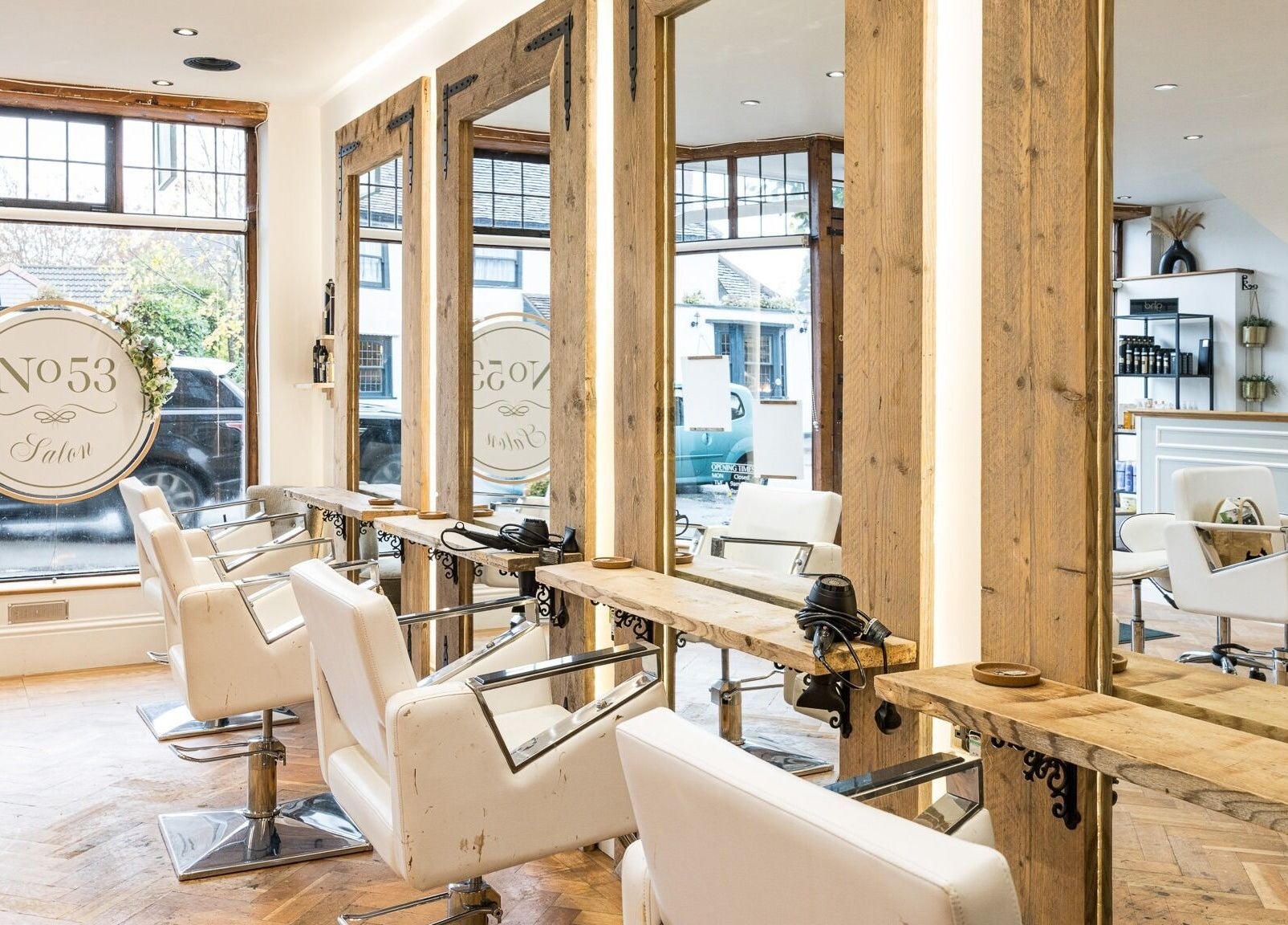 Elegant interior of No 53 Salon in Walton on the Hill, England. Featuring chic styling chairs and rustic decor.