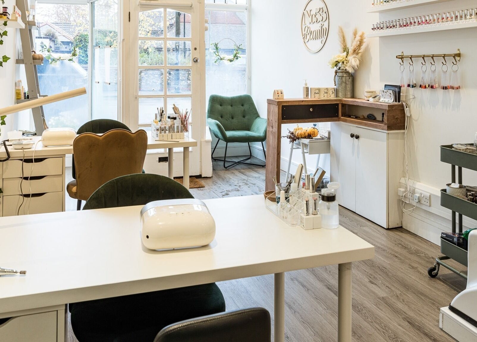 Elegant interior of No 53 Salon in Walton on the Hill, England, featuring stylish chairs and beauty stations.