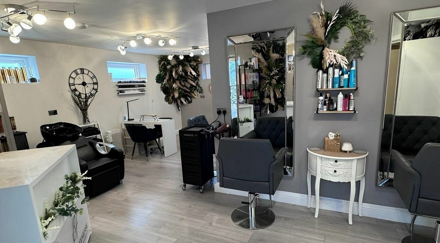 Elegant interior of Beauty Finesse Hair and Beauty in Chorley, England, GB, featuring modern salon chairs and decor.