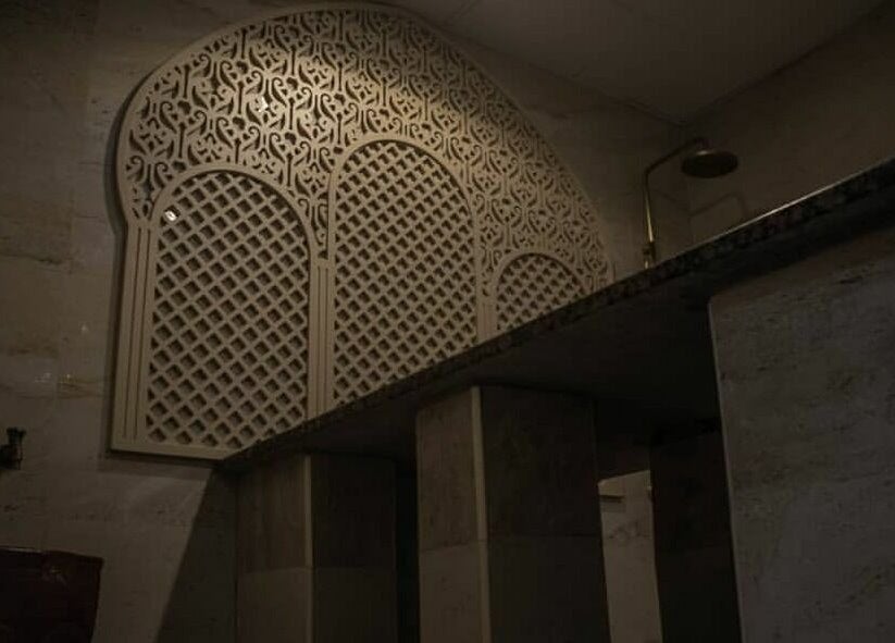 Elegant shower area with arched decor at Super Star Gents Salon Al Jerf 2, Ajman, Ajman, AE.
