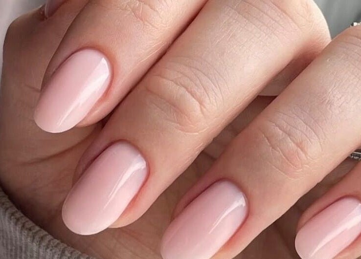 Elegant gel manicure at The Nail Lab in Leeds, England, GB showcasing glossy pink nails.