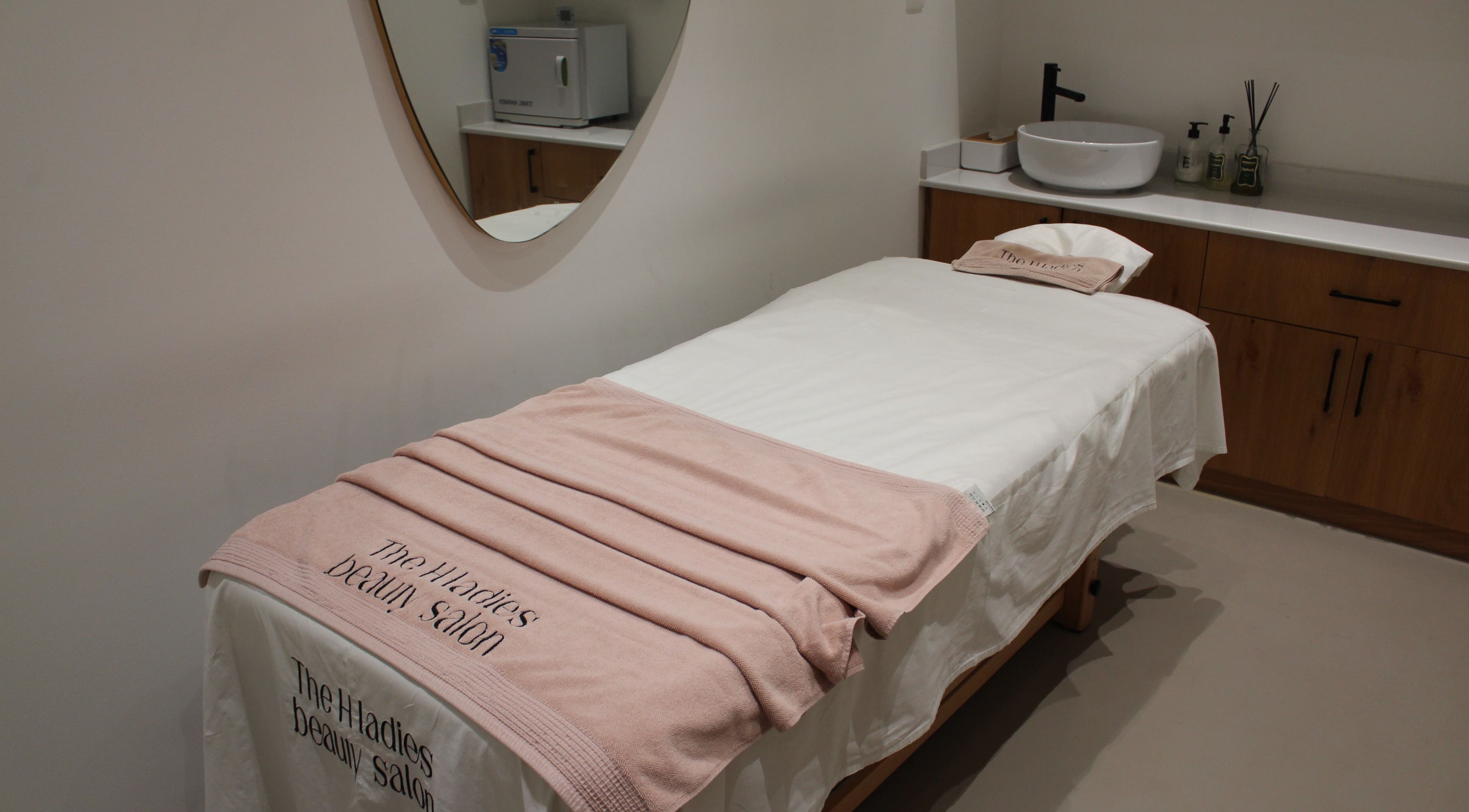 Cozy treatment room at The H Ladies Beauty Salon - L.L.C - O.P.C, Abu Dhabi, Abu Dhabi, AE with a massage bed.