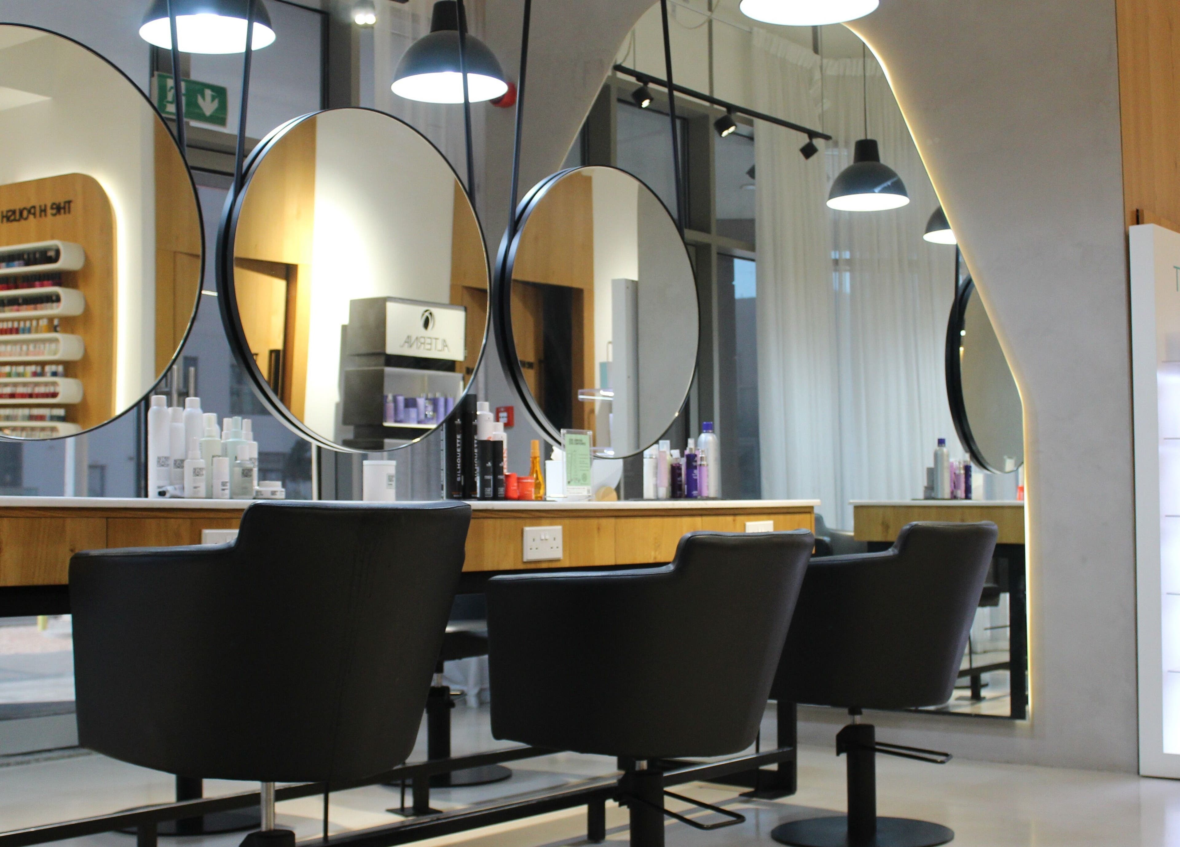 Modern salon interior with sleek styling chairs at The H Ladies Beauty Salon - L.L.C - O.P.C, Abu Dhabi, Abu Dhabi, AE.