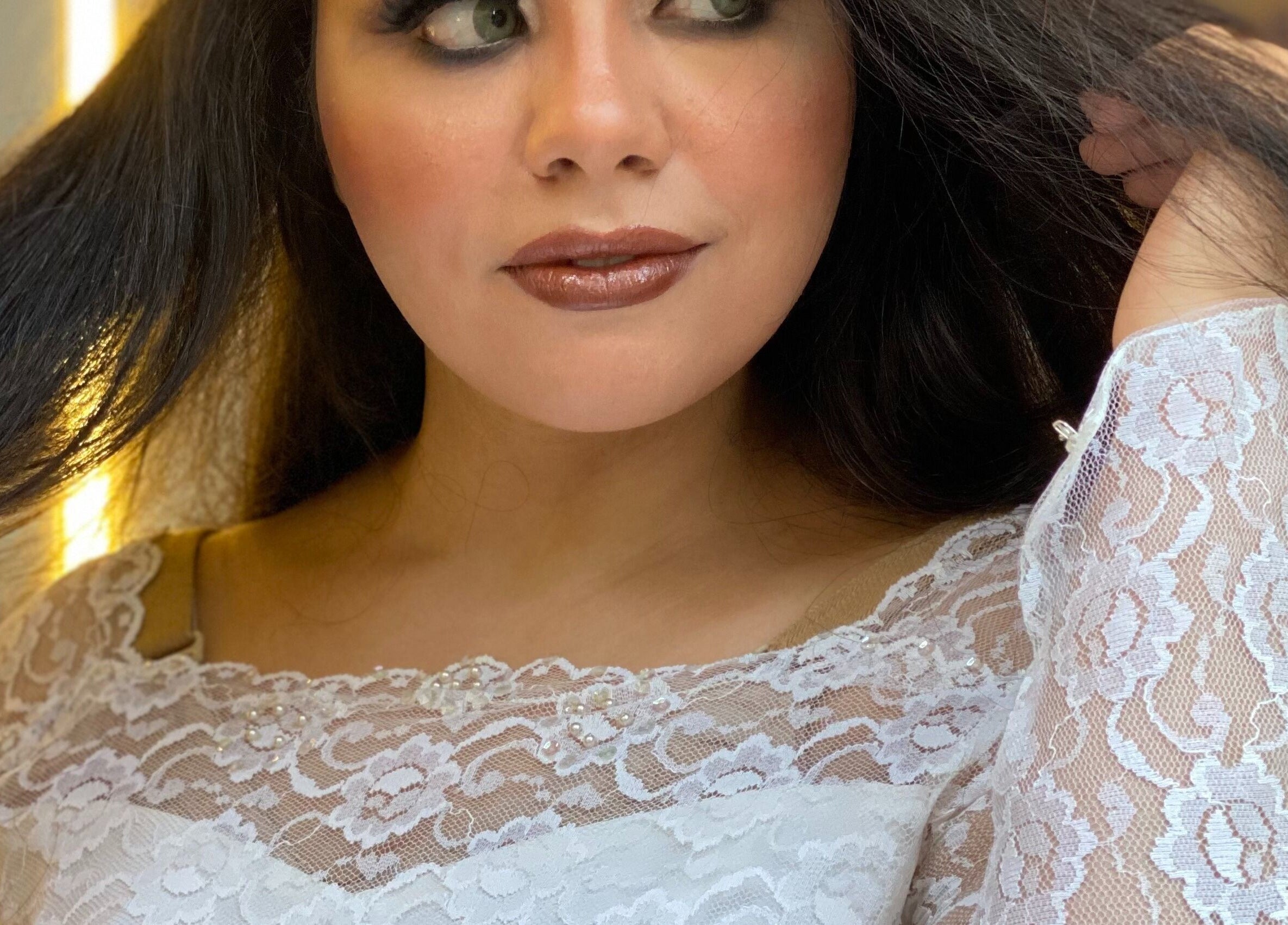 Close-up of a woman in lace dress at Basma and Hana, Cairo Governorate, Cairo Governorate, EG.