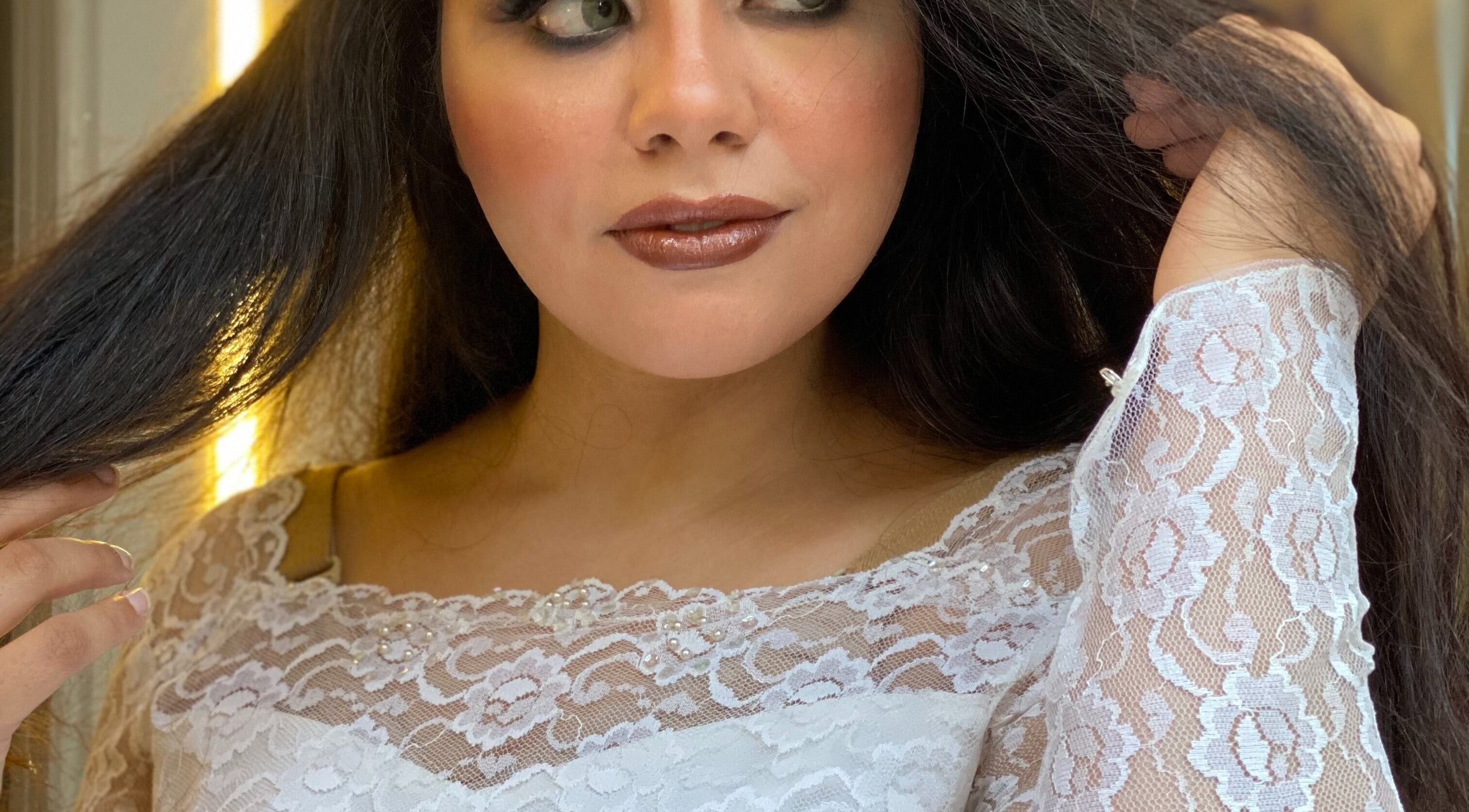 Close-up of a woman in lace dress at Basma and Hana, Cairo Governorate, Cairo Governorate, EG.