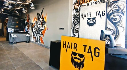 Interior of Hair Tag - Al Jaddaf in Dubai, AE, featuring vibrant wall art and modern design.