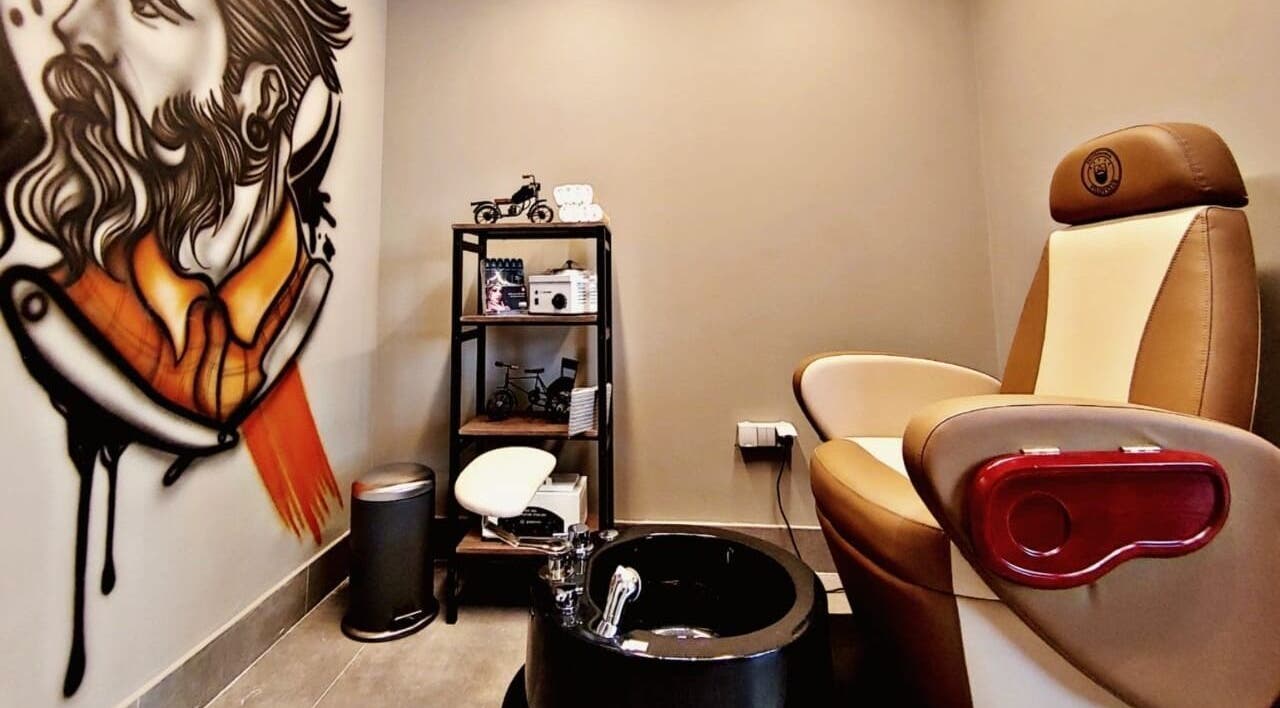Hair Tag - Al Jaddaf's elegant grooming corner with mural and plush seating in Dubai, AE.