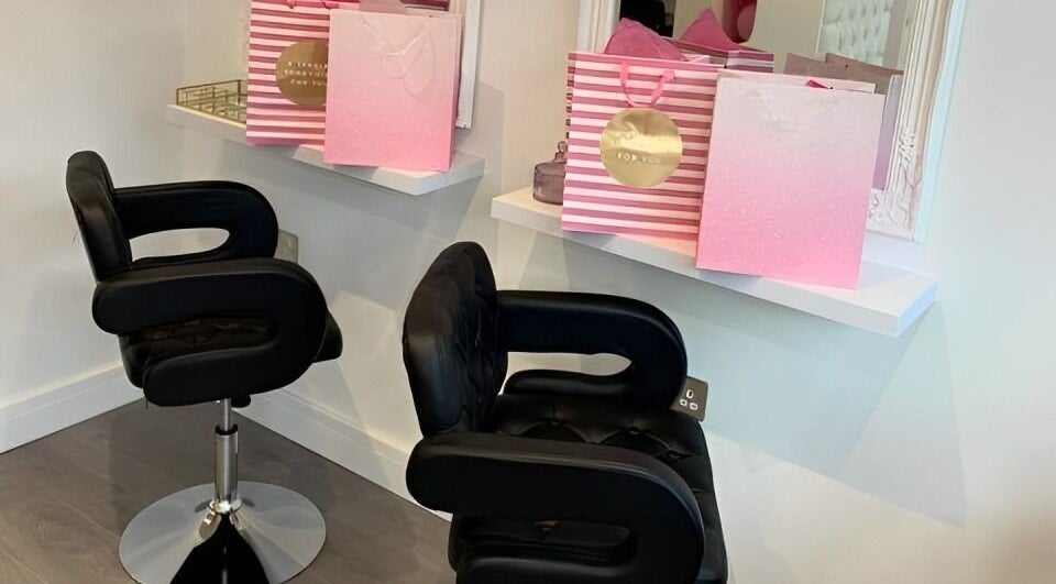 Elegant salon chairs and gift bags at LUX Hair, Beauty & Aesthetics in Congleton, England, GB.