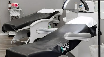BBare Beauty Bar's relaxing treatment room with modern spa beds in Cambridge, Ontario, CA.