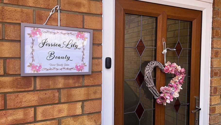 Entrance sign and floral wreath at Jessica Lily Beauty in Long Buckby, England, GB.