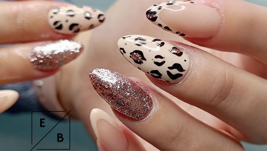 Stylish leopard print and glitter nails at Enchanted Belle, Boksburg, Gauteng, ZA.