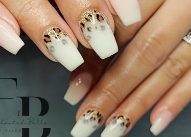 Leopard print nail art at Enchanted Belle in Boksburg, Gauteng, ZA, showcasing elegant white nails.