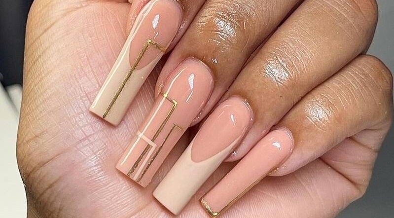Elegant nude nails with geometric design at Beauty Plus Academy & Salon, Kingston, St. Andrew Parish, JM.
