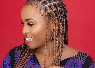 Close-up of woman with intricate braids at Beauty Plus Academy & Salon, Kingston, St. Andrew Parish, JM.