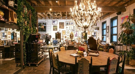 Elegant interior of Esstudio Galleria, Chippendale. Features vintage decor and grand chandelier.