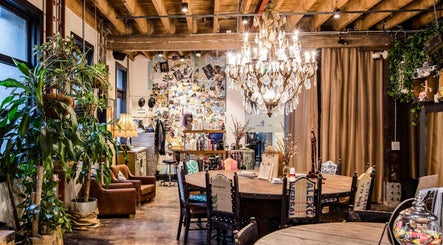 Stylish interior of Esstudio Galleria in Chippendale, New South Wales, with chandelier and rustic decor.