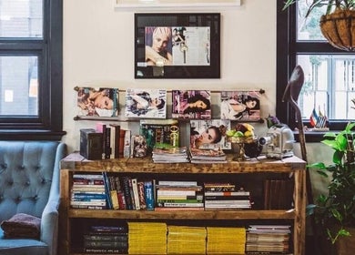Cozy reading corner at Esstudio Galleria, Chippendale, New South Wales, AU with stylish decor and magazines.